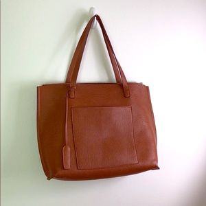 Like-new purse with front pocket, top zip closure